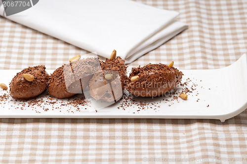 Image of chocolate mousse quenelle dessert