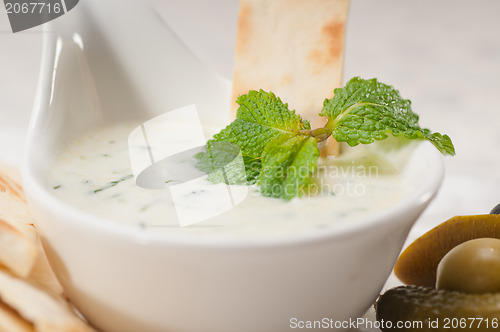 Image of Greek Tzatziki yogurt dip and pita bread