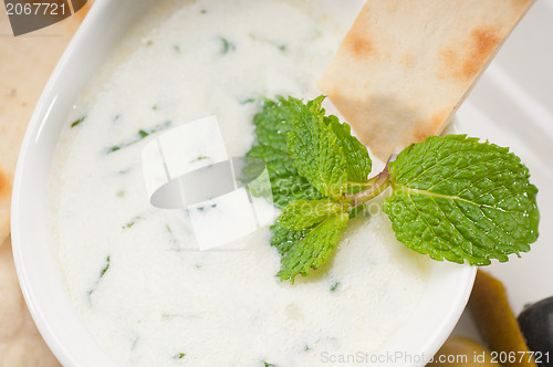 Image of Greek Tzatziki yogurt dip and pita bread