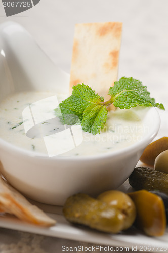 Image of Greek Tzatziki yogurt dip and pita bread