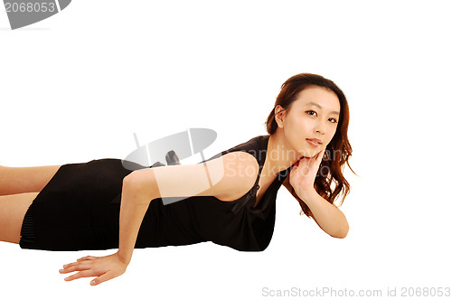 Image of Asian girl lying on floor.