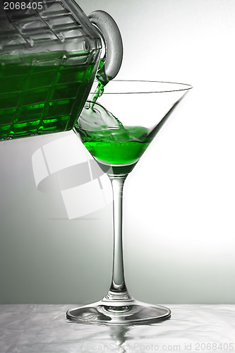 Image of Pouring a green drink