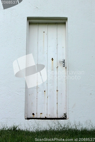 Image of Neglected Old Rusted White Zinc Door