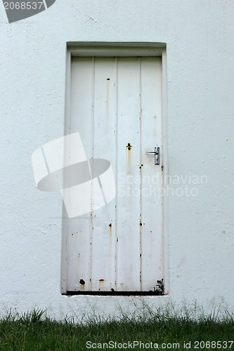 Image of Neglected Old Rusted White Zinc Door