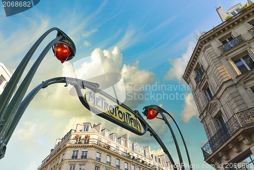 Image of Metro station sign in Paris with beautiful background sky