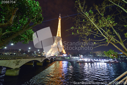 Image of PARIS - DEC 1: Eiffel Tower shows its wonderful lights in the ev