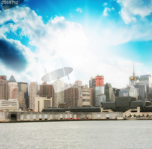 Image of Manhattan. Beautiful sky colors over New York City skyscrapers, 