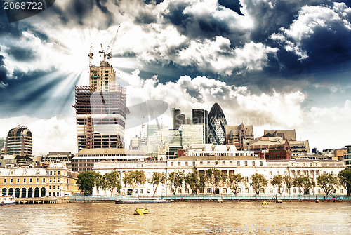 Image of City of London financial center with Thames river in foreground