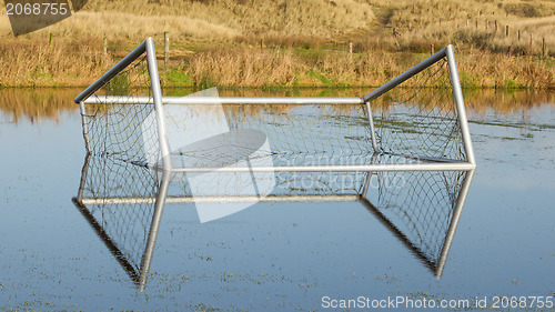 Image of Football goal in a flooded field