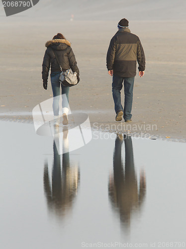 Image of Couple walking on a dutch beach