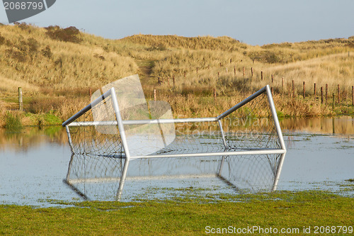 Image of Football goal in a flooded field