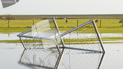 Image of Football goal in a flooded field