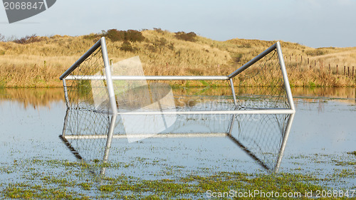 Image of Football goal in a flooded field