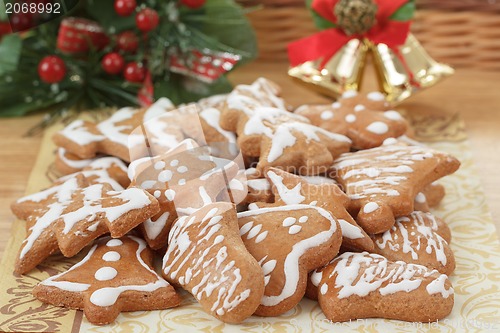 Image of christmas gingerbreads and decoration on wooden table