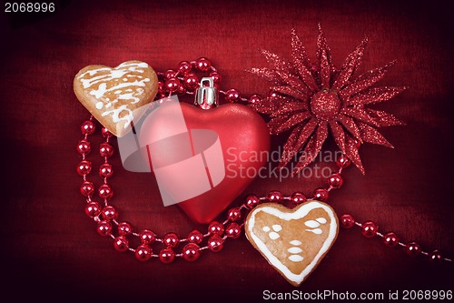 Image of valentine hearts with flower on red background