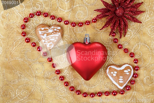 Image of red heart on christmas tablecloth