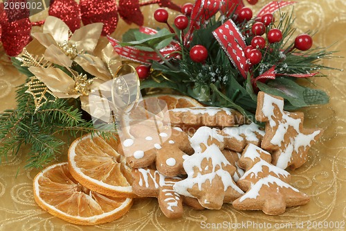 Image of christmas background with needles. orange slices and gingerbreads