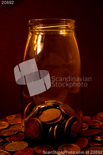 Image of Coins in a glass bottle