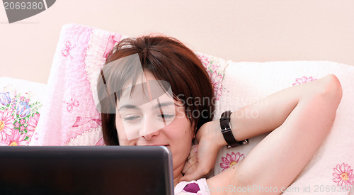 Image of Young woman with laptop 