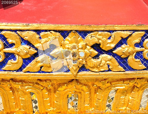 Image of The gold stucco design of native thai style on the Wall 