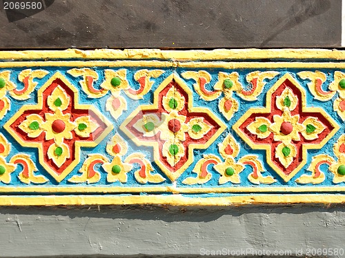 Image of The gold stucco design of native thai style on the Wall 