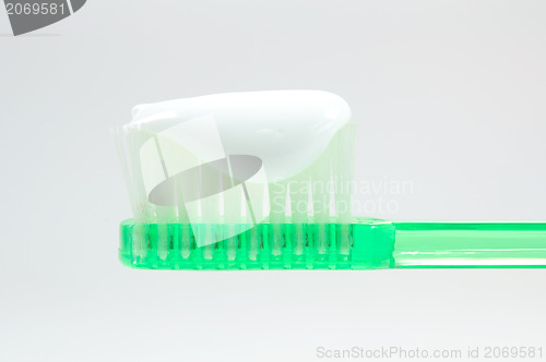 Image of green toothbrush isolated on white 