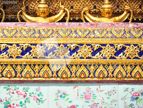 Image of The gold stucco design of native thai style on the Wall 