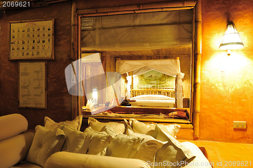 Image of Bedroom in a wood bungalow. 