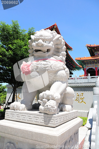 Image of White lion statue decoration in front of temple