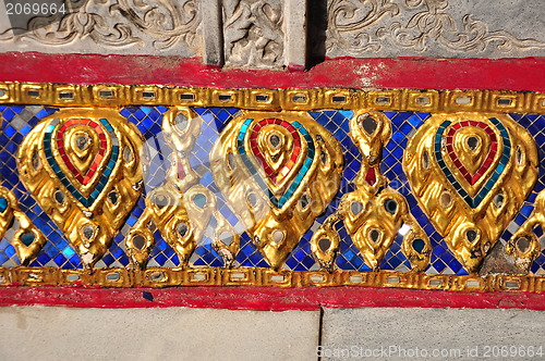 Image of The gold stucco design of native thai style on the Wall 