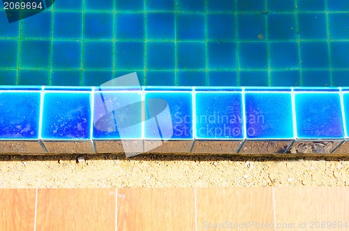 Image of Swimming pool with stair and green relaxing water 