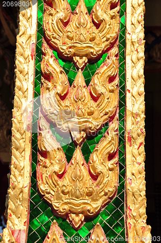 Image of The gold stucco design of native thai style on the Wall 