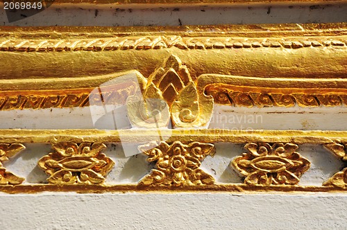 Image of The gold stucco design of native thai style on the Wall 