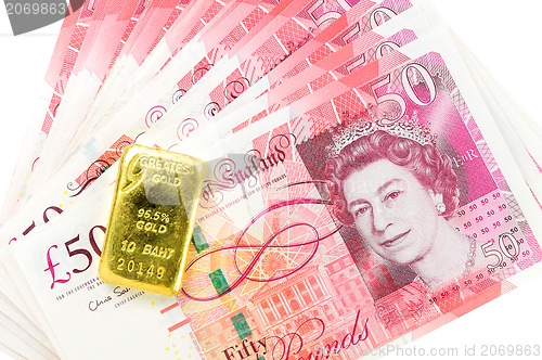 Image of 50 pound sterling bank notes closeup view business background