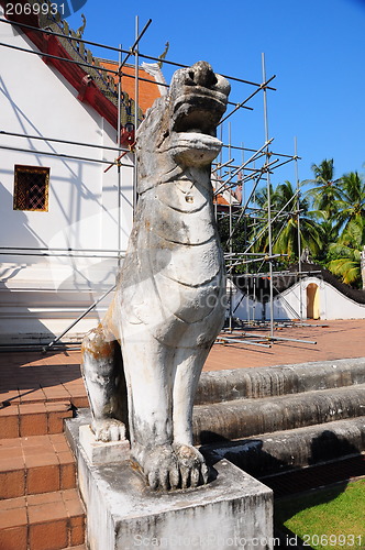 Image of White lion statue decoration in front of temple