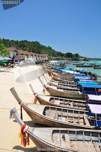 Image of motor long tail boat parking at Phi Phi beach Phuket Thailand 