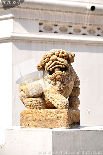 Image of White lion statue decoration in front of temple