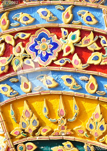 Image of The gold stucco design of native thai style on the Wall 