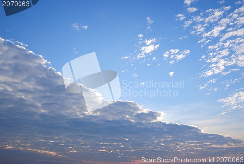 Image of Blue sky with clouds and sun. 