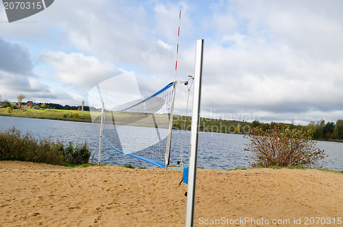 Image of volleyball court sand net autumn lake shore 
