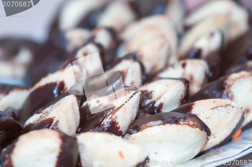 Image of pastry cookies sandwich in chocolate