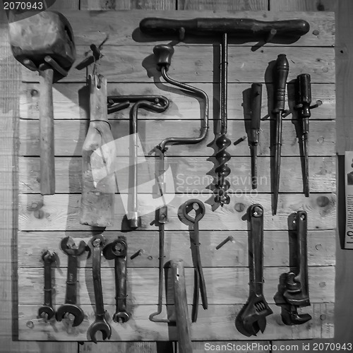 Image of old tools on the wall