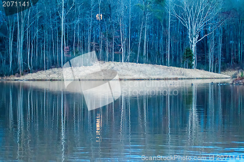 Image of moon reflecting in lake