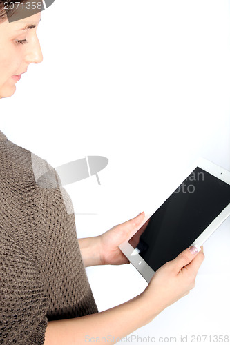 Image of Woman reading a tablet screen