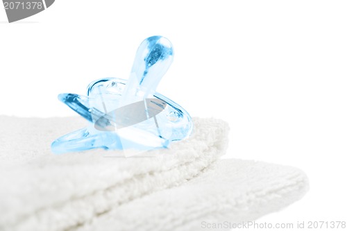 Image of Baby pacifier on towel