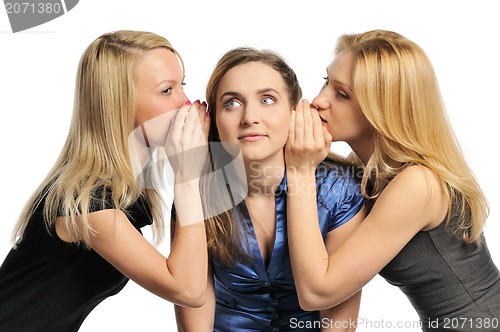 Image of Three young girls gossiping