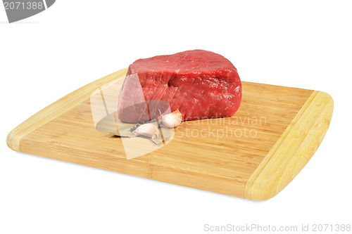 Image of Raw Beef on wooden board