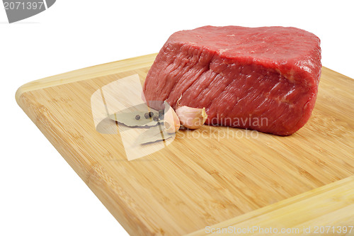 Image of Raw Beef on wooden board