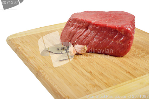 Image of Raw Beef on wooden board