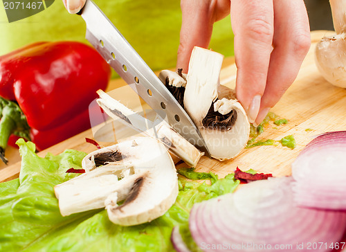 Image of cutting mushroom champignon